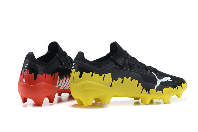 Botas de fútbol para césped Ultra FG en color negro, amarillo y naranja